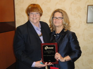 Dr. Sandra Eggenberger (right) receives MNRS 2015 Senior Nurse Scientist Award from Dr. Kathleen Sawin (left)