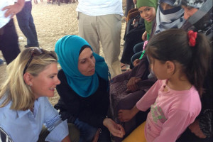 International Development Secretary, Justine Greening, talking with Syrian children at a UK-funded clinic in the Zaatari refugee camp, Jordan. Picture: Peter Millett/British Embassy Jordan